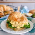 Egg Salad Sandwich on a Croissant Roll with lettuce.