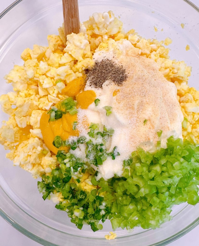 Egg Salad ingredients in a bowl.