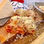 Deep dish hot pocket pizza slices on a cutting board.